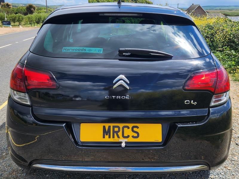 A black Citroen C4 viewed from the back