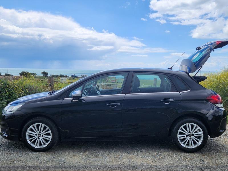 A black Citroen C4 viewed from the passenger side