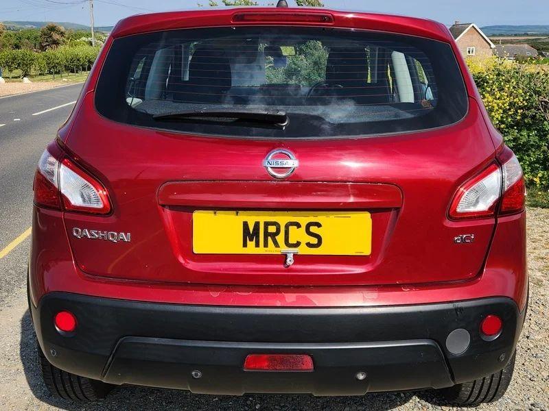 A red Qashqai Acenta viewed from the back