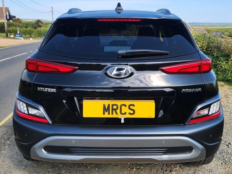 A black Hyundai Kona viewed from the back