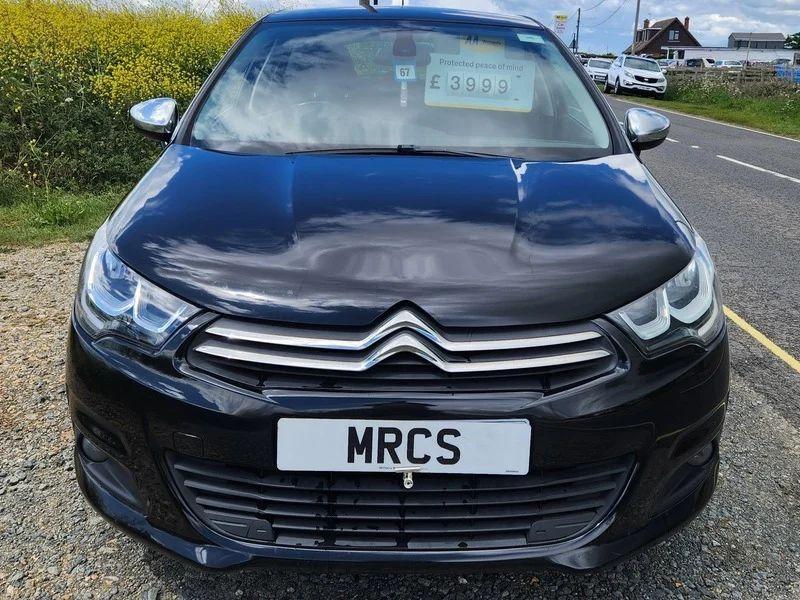 A black Citroen C4 viewed from the front