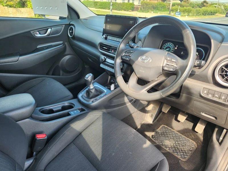 The steering controls of a black Hyundai Kona viewed from above the driver seat