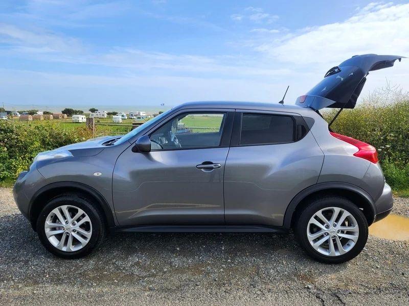 A grey Nissan Juke viewed from the passenger side