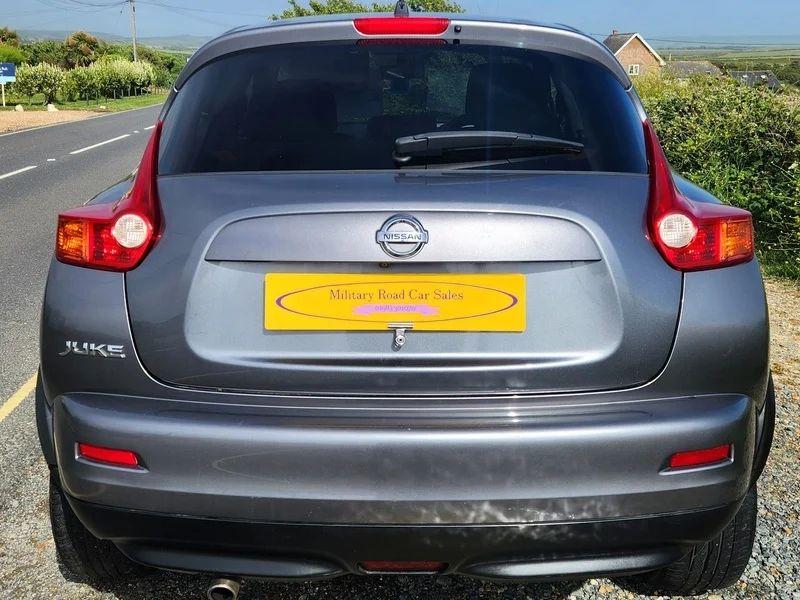 A grey Nissan Juke viewed from the back