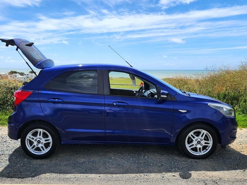A blue Ford Ka viewed from the driver side