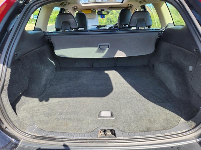 The open boot of a black Volvo XC60 viewed from the back