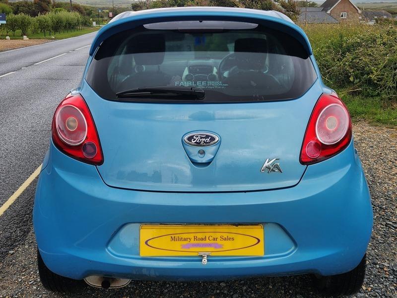 A blue Ford Ka viewed from the back