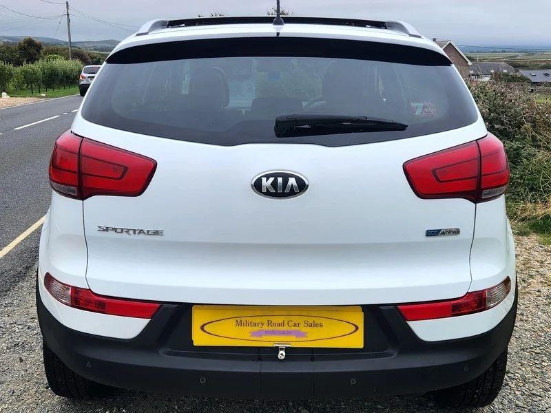 A white Kia Sportage viewed from the back