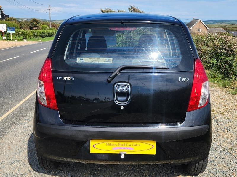 The open boot of a black Hyundai i10 viewed from the back