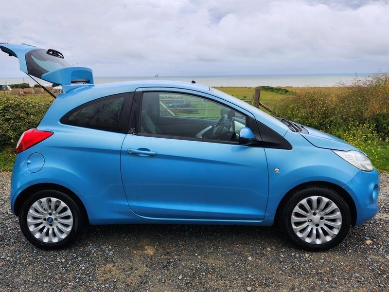 A blue Ford Ka viewed from the driver side