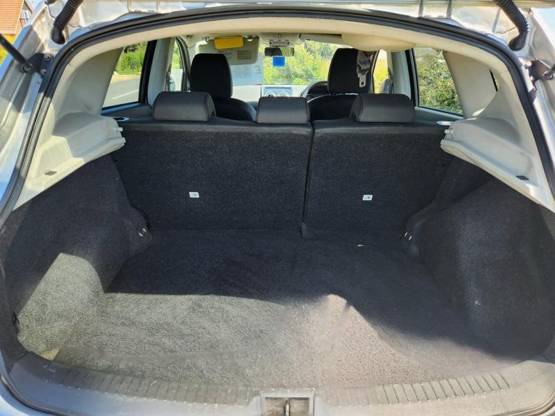 The open boot of a silver Nissan Qashqai viewed from the back