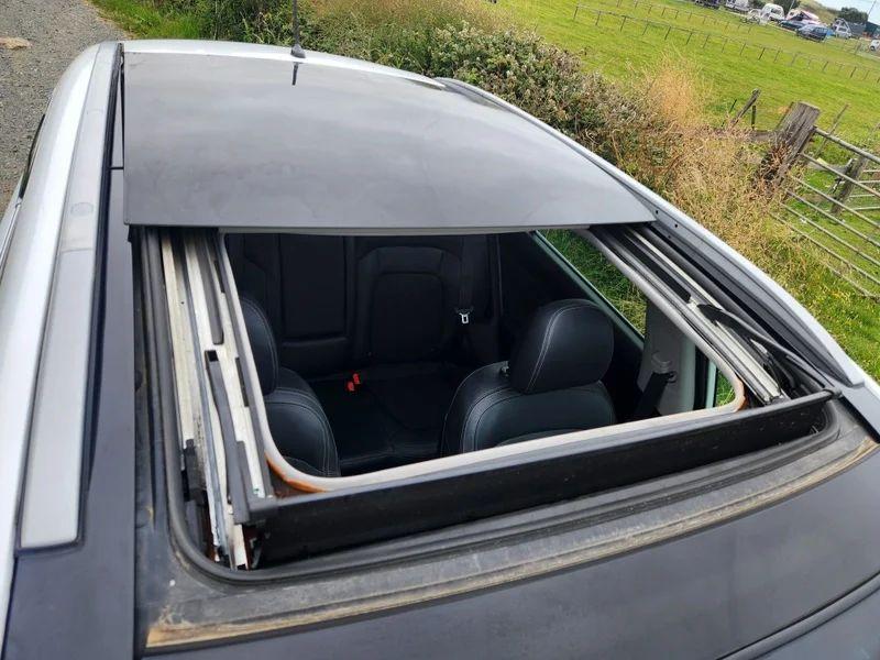 A white Kia Sportage viewed from above