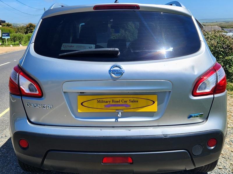 A silver Nissan Qashqai viewed from the back