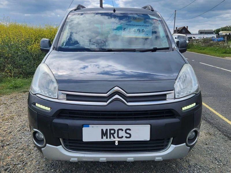 A black Citroen Berlingo viewed from the front