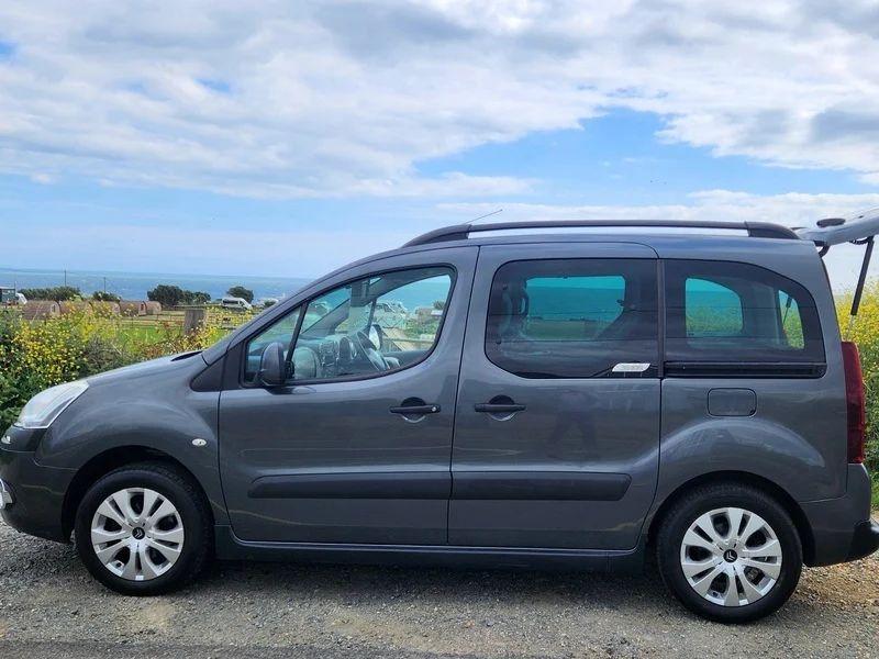 A black Citroen Berlingo viewed from the passenger side