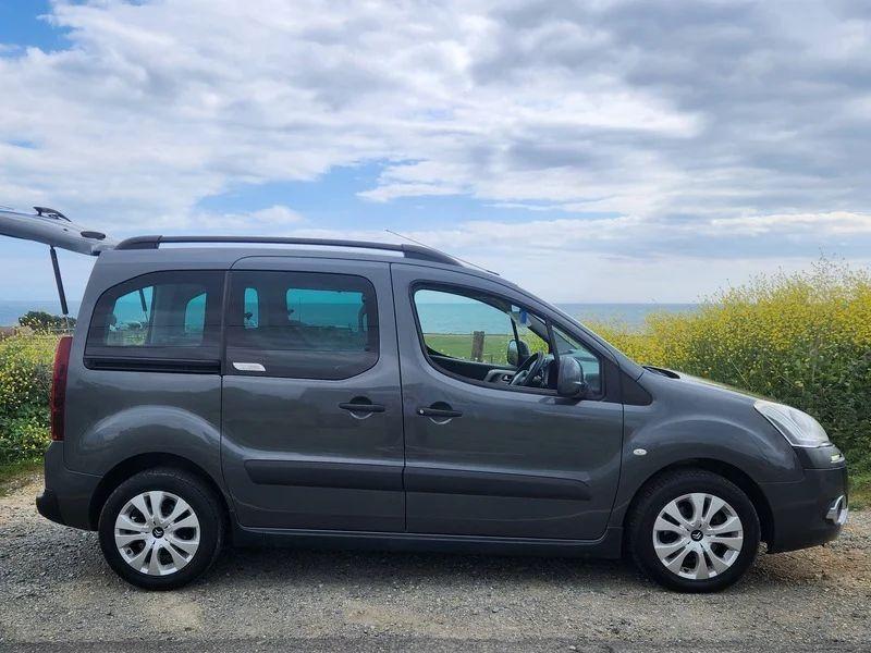 A black Citroen Berlingo viewed from the driver side