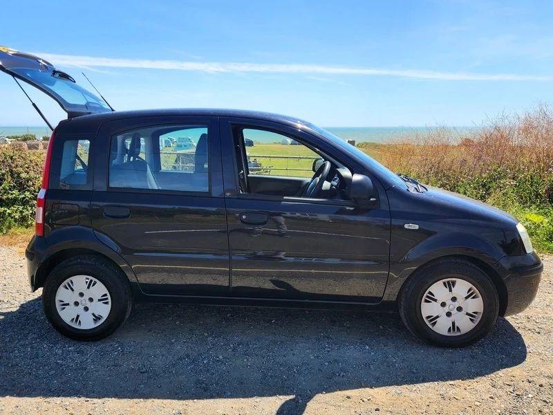 A black Fiat Panda viewed from the driver side