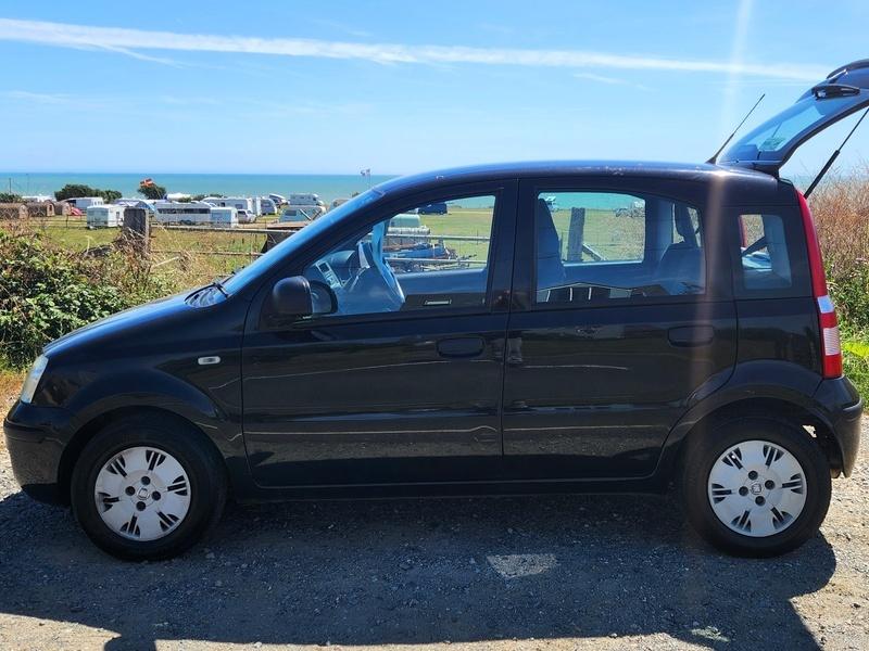 A black Fiat Panda viewed from the passenger side