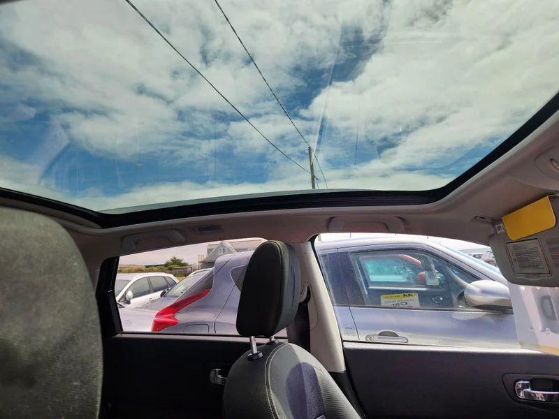 The skylight of a white Nissan Qashqai viewed from the driver side