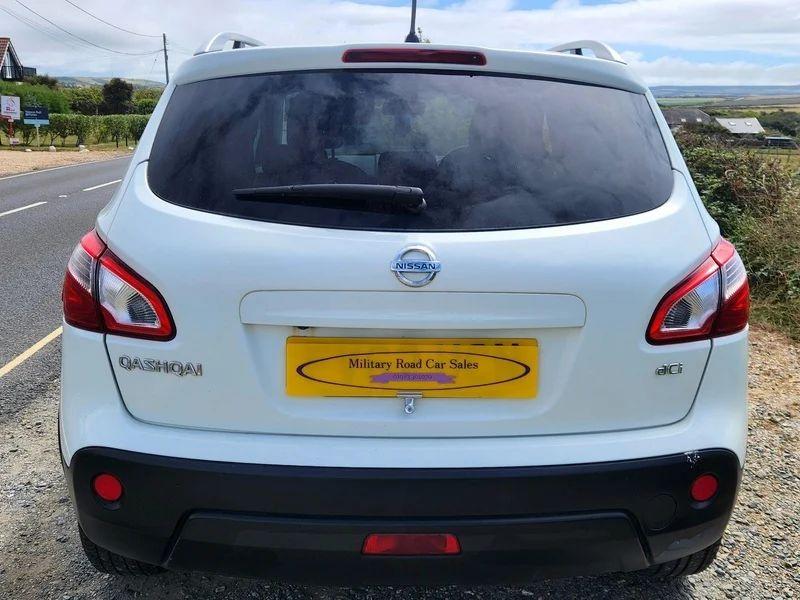 A white Nissan Qashqai viewed from the back
