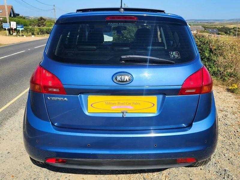 A blue Kia Venga viewed from the back