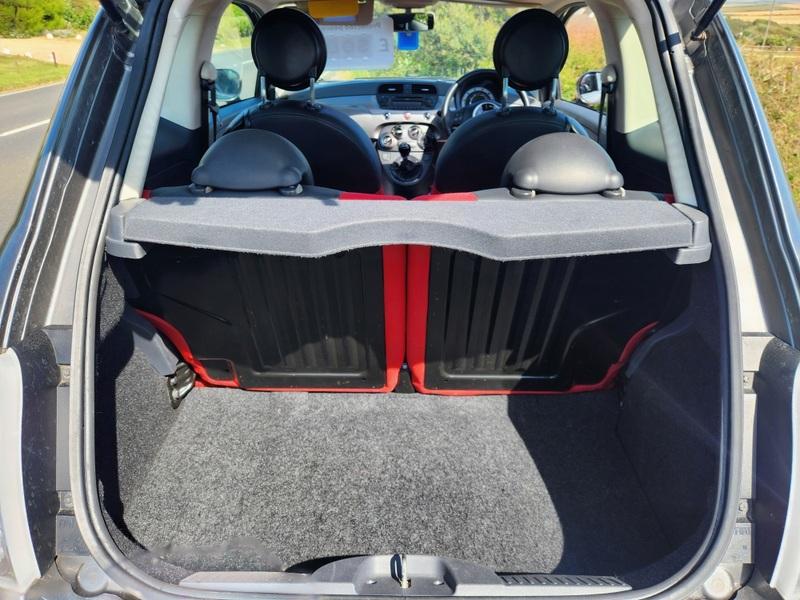 The open boot of a grey Fiat 500 Lounge viewed from the back