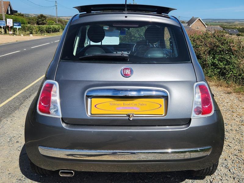 A grey Fiat 500 Lounge viewed from the back