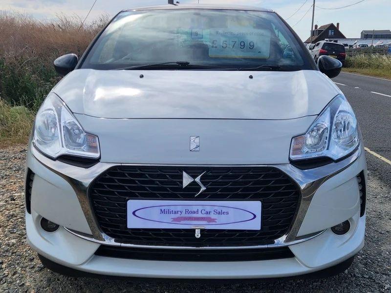 A white Citroen DS viewed from the front