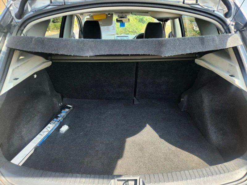 The open boot of a grey Nissan Qashqai viewed from the back