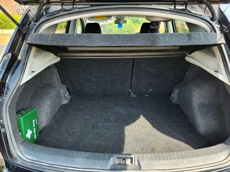 The open boot of a black Nissan Qashqai viewed from the back