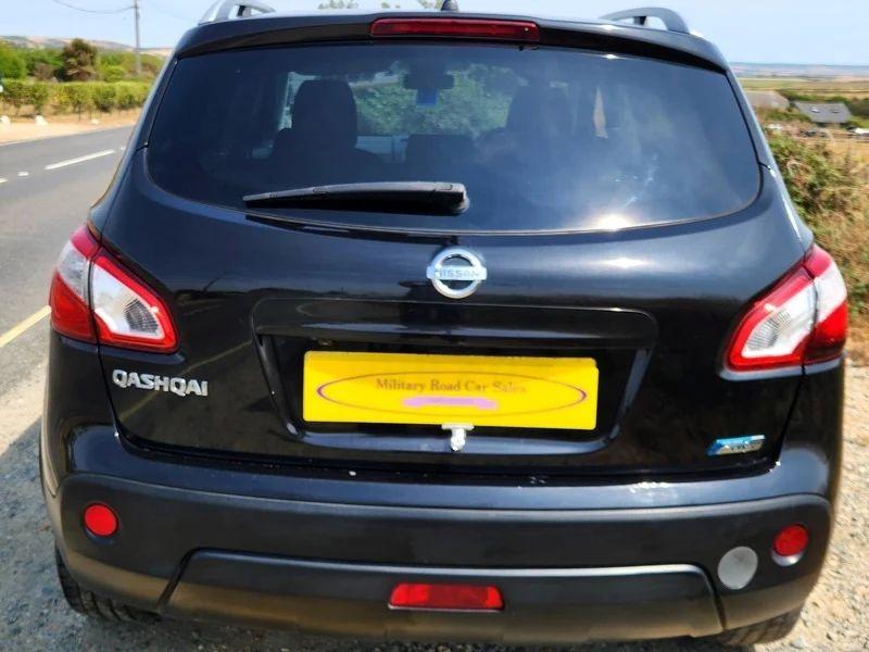 A black Nissan Qashqai viewed from the back