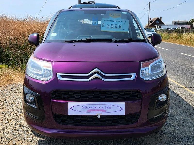 A violet Citroen C3 Picasso viewed from the front