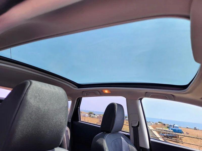 The sunroof of a black Nissan Qashqai viewed from the driver seat