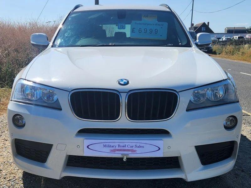 A white BMW X3 viewed from the front