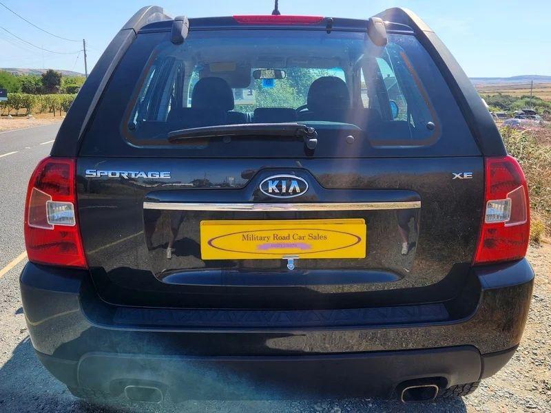 A black Kia Sportage viewed from the back
