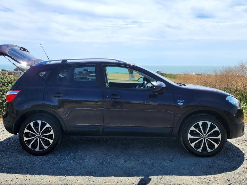 A black Nissan Qashqai viewed from the driver side