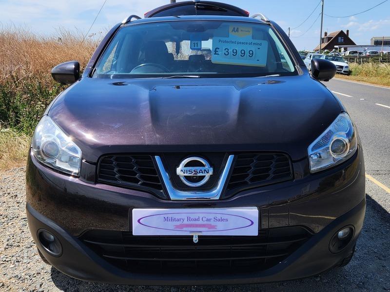 A black Nissan Qashqai viewed from the front