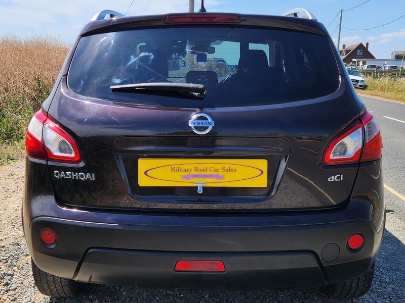 A black Nissan Qashqai viewed from the back