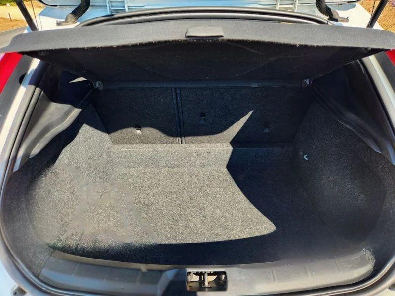 The open boot of a white Volvo V40 viewed from the back