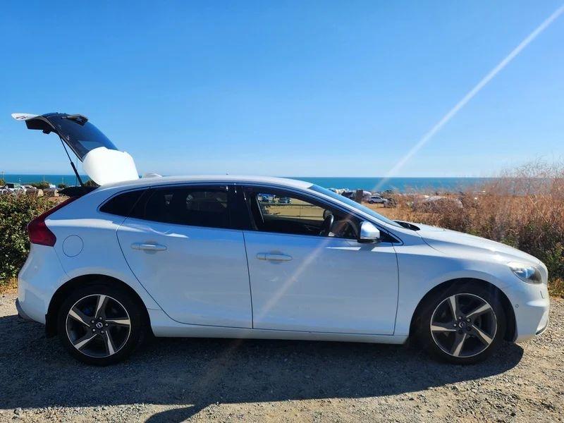 A white Volvo V40 viewed from the driver side