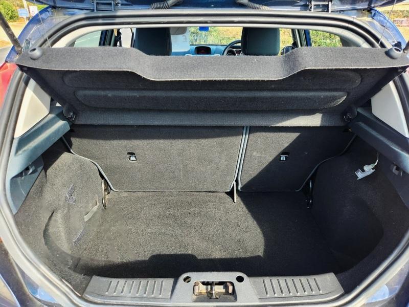 The open boot of a Deep Midnight Blue Ford Fiesta viewed from the back