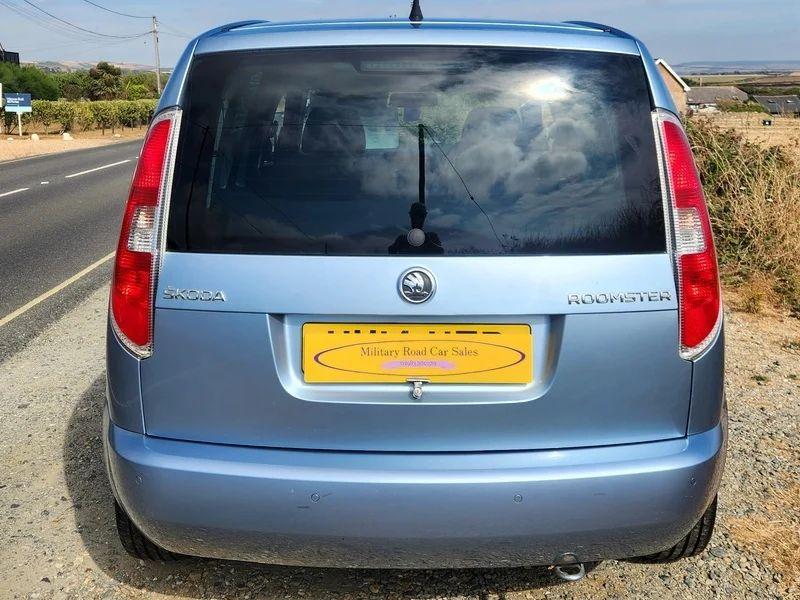 A silver blue Skoda Roomster viewed from the back