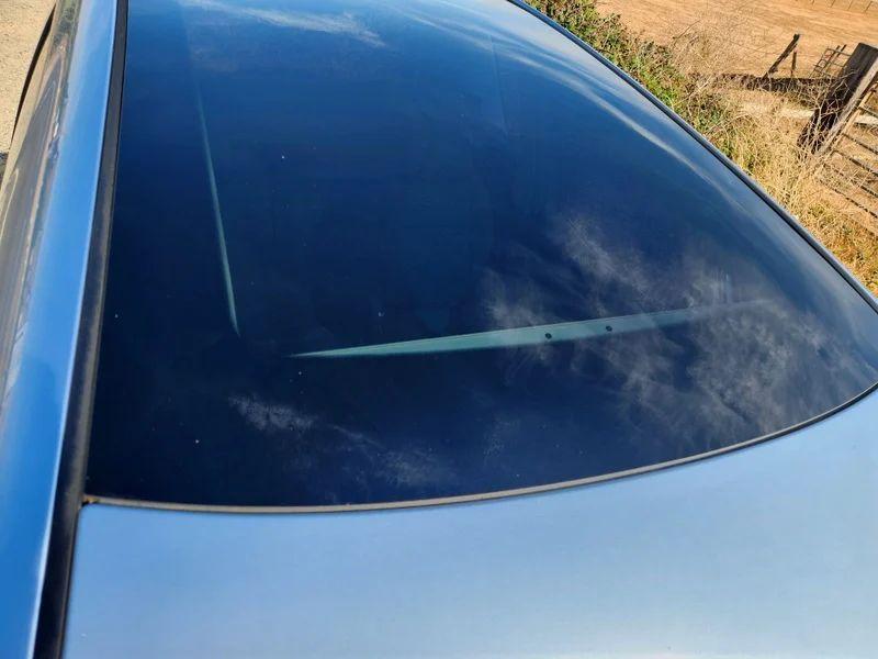 The sunroof of a silver-blue Skoda Roomster viewed from above