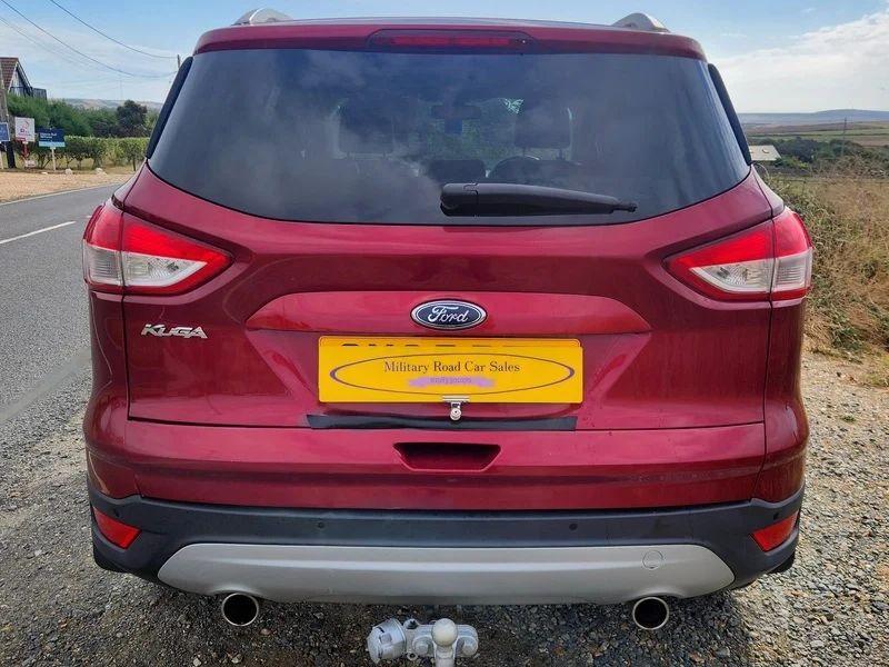 A red Ford Kuga viewed from the back