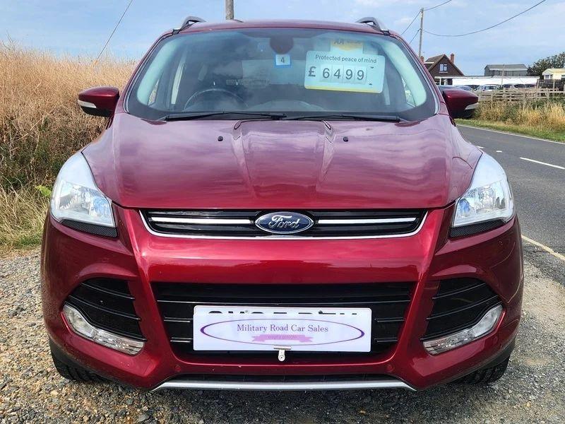A Red Ford Kuga viewed from the front