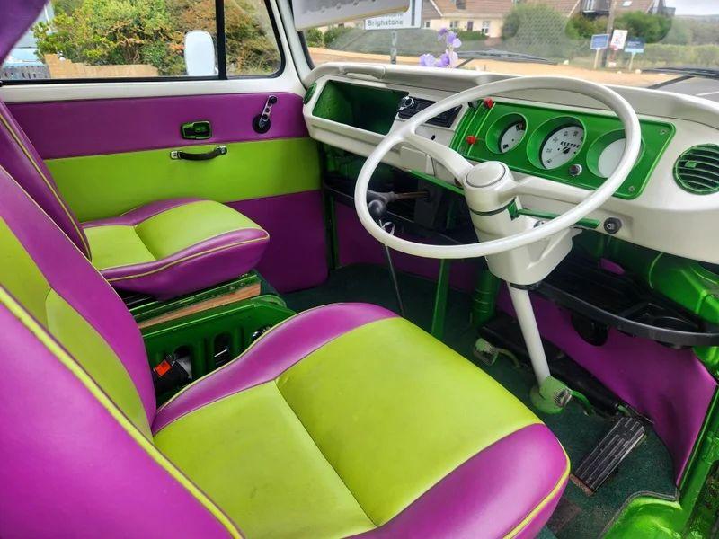 The steering controls of a Volkswagen Camper Van viewed from above the driver seat