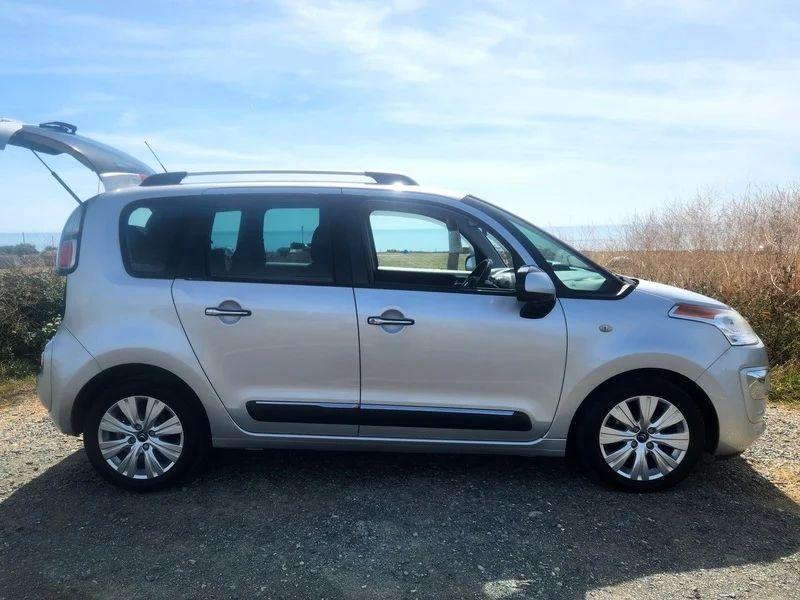 A silver Citroen Picasso viewed from the driver side