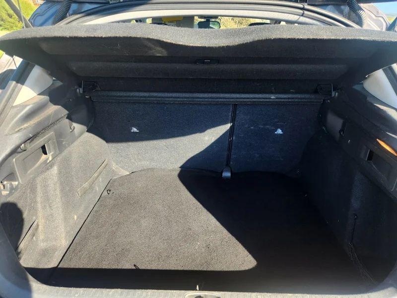 The open boot of a Shark Grey Metallic Citroen C4 viewed from the back