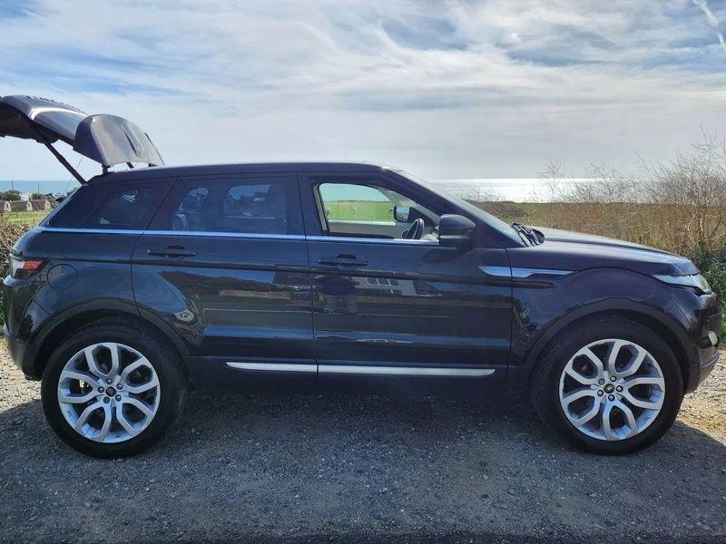 A Santorini Black Range Rover with an open boot viewed from the driver side