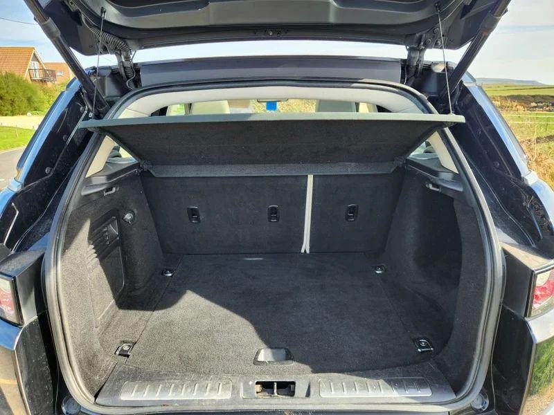 The open boot of a Santorini Black Range Rover viewed from the back